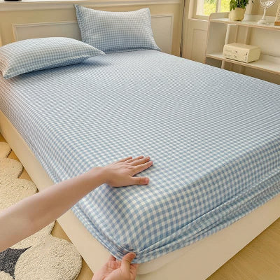 Drap-housse 90 x 190 carreaux bleu main fixe coin