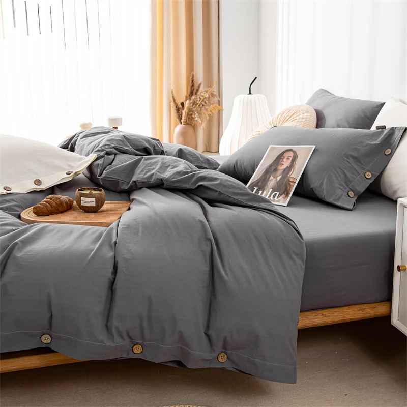Chambre parure lit gris croissant revue sur lit