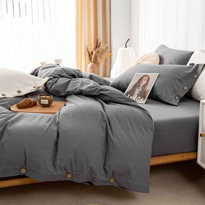 Chambre parure lit gris croissant revue sur lit