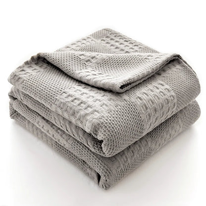 Couverture gris clair pliée