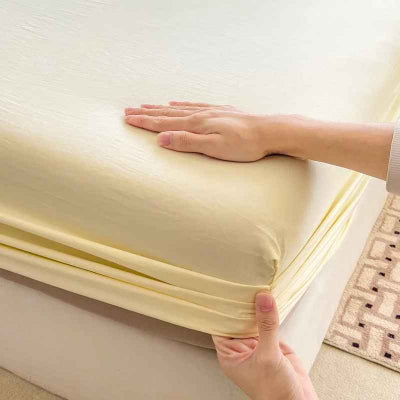 Drap-housse 90 x 190 jaune mains fixe coin