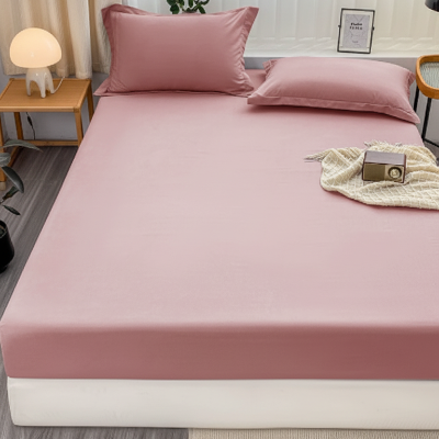 Drap housse rose plaid sur lit vue de face