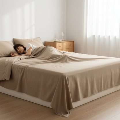 Draps coton lavé ultra doux femme allongée sommeil