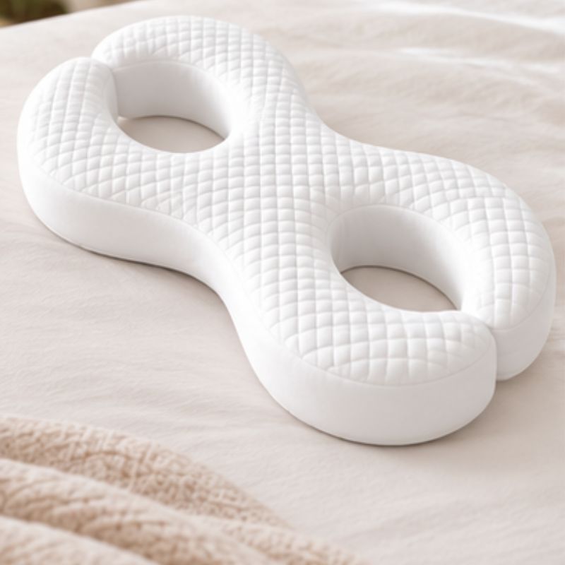 Oreiller à mémoire de forme anti-rides couché sur lit