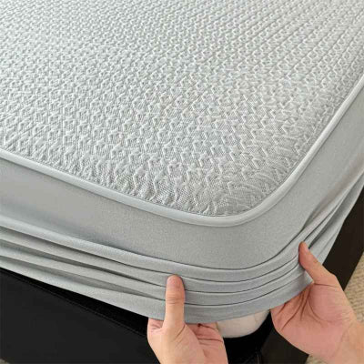 Protège matelas imperméable mains fixes coin