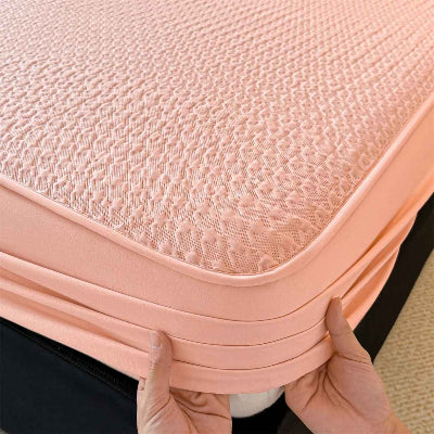 Protège matelas imperméable rose mains fixes coin